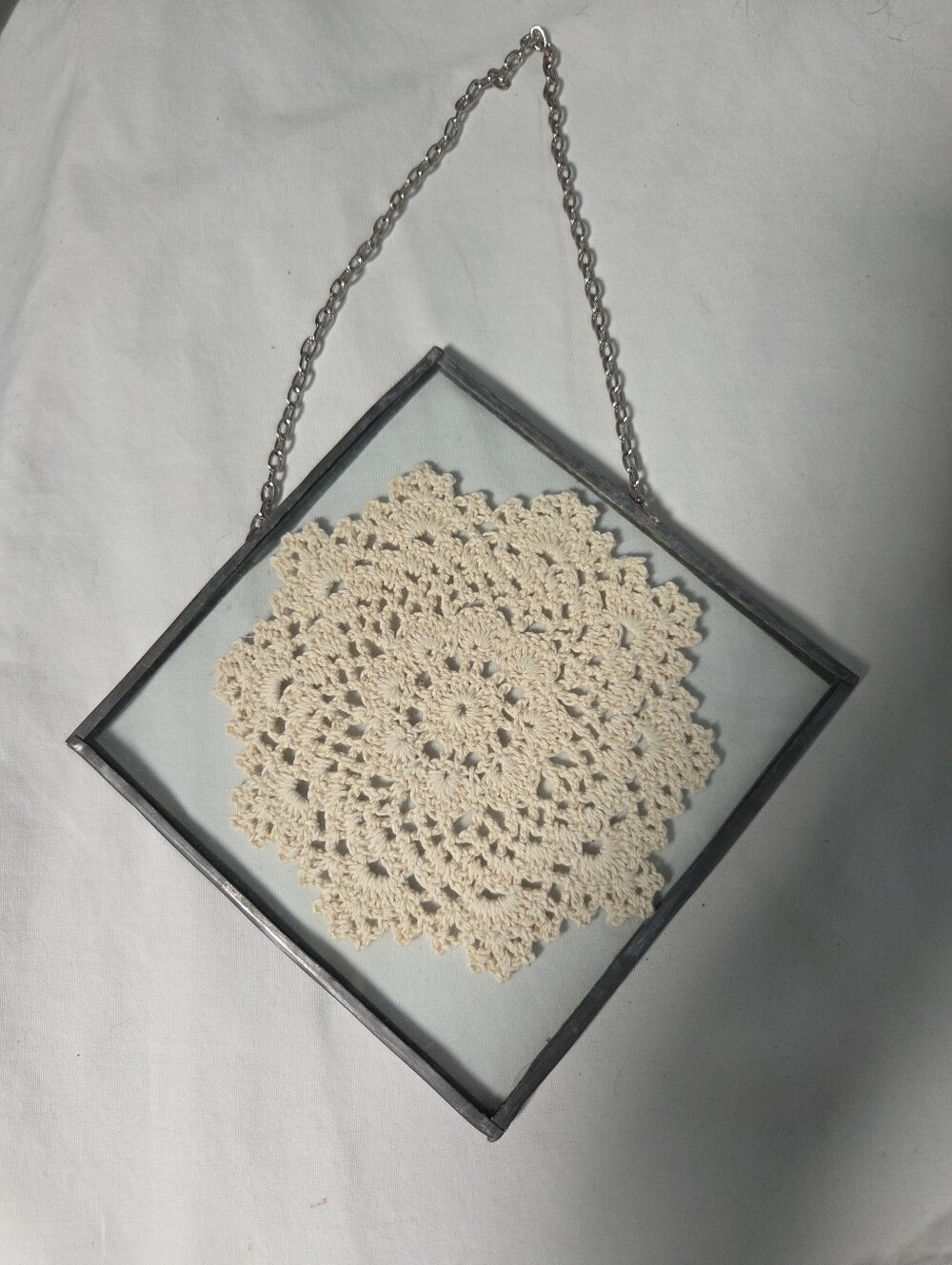 vintage Suncatcher leaded glass wall hanging featuring a handmade crochet doily.